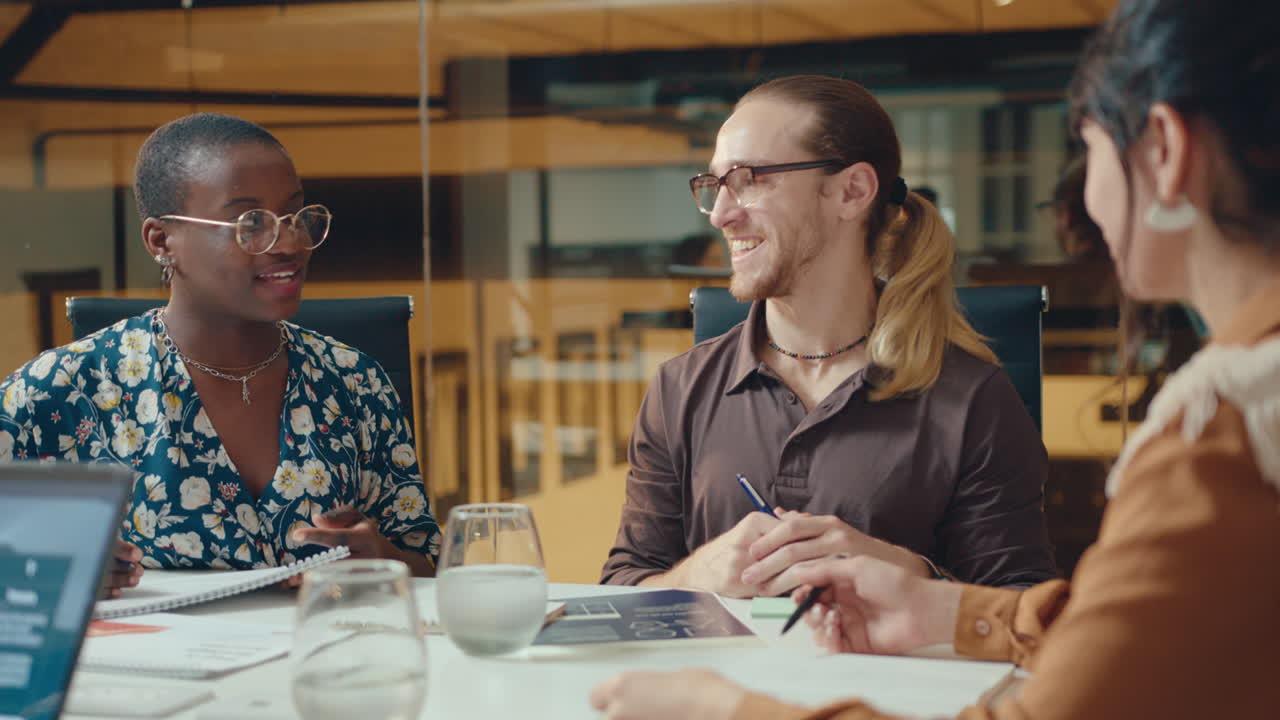Multi-ethnic Business Team Discussing Plans with Female CEO