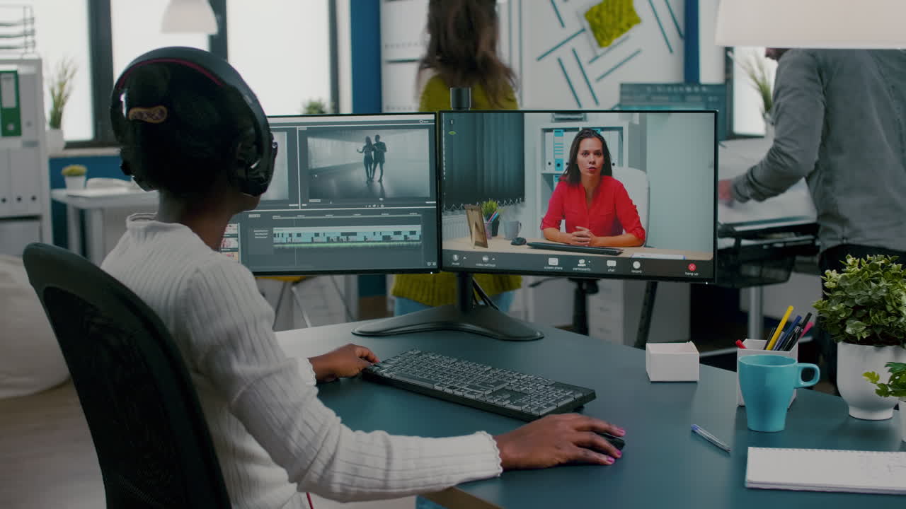Black woman videographer in web online conference with project manager