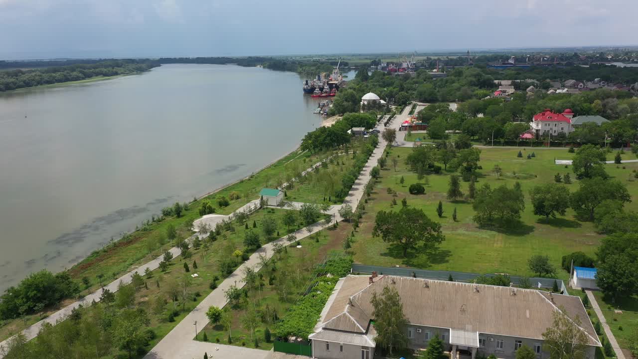 Holy Assumption Church along the Danube Embankment in the park in Izmail city aerial view.