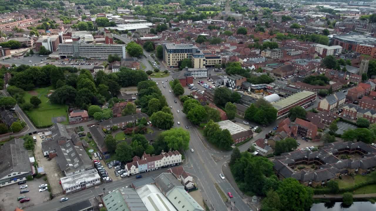 Aerial footage over Norwich City, Norfolk. The video starts over a roundabout and moves forward while the frame is slightly angled to the right along the inner ring road, St Crispins Road.