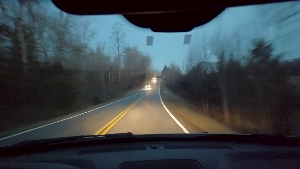 Slow motion footage of driving along several roads in central Virginia