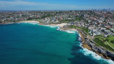 panoramic view of tamarama and bronte beach in summer in sydney, nsw, australia - drone shot