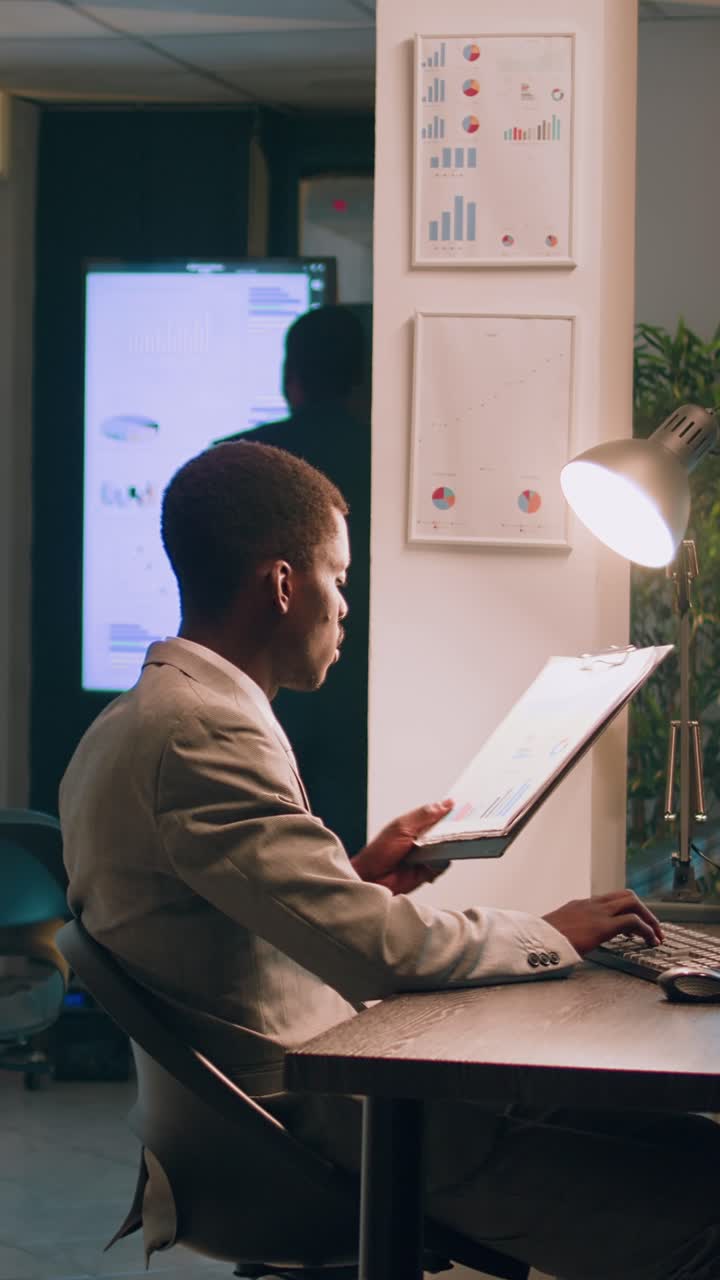 Vertical video Employees checking company figures