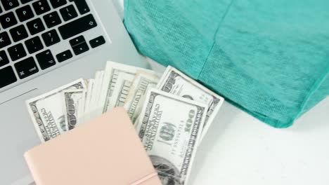 fresh vegetables in shopping bag with currency on laptop