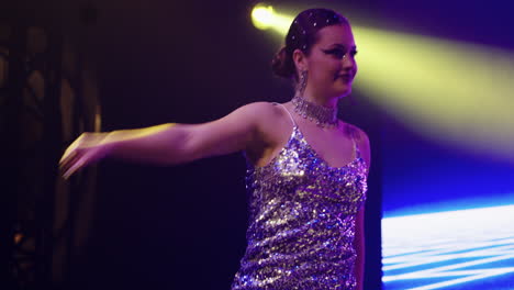 a woman dancing on stage at a nightclub