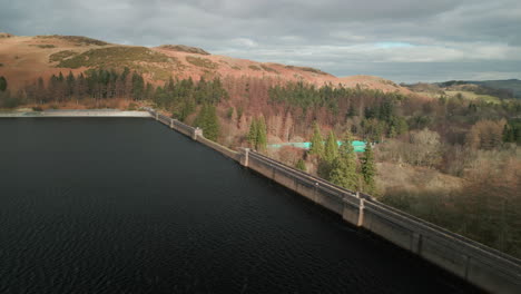 reservoir dam wall and winter landscape at haweswater english lake district uk