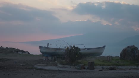 Scenic-sunset-landscape-shot-of-small-traditional-fishing-boat