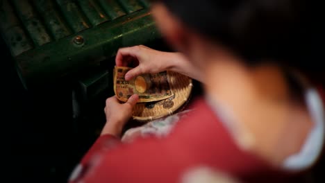 woman in kimono donating money and coins