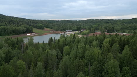 mountain resort landscape with lake and forest