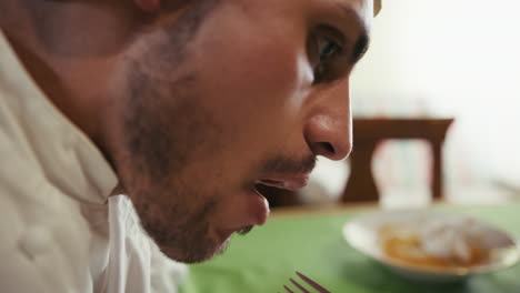 the little food of a lonely man eating his last pieces of meat at dinner table
