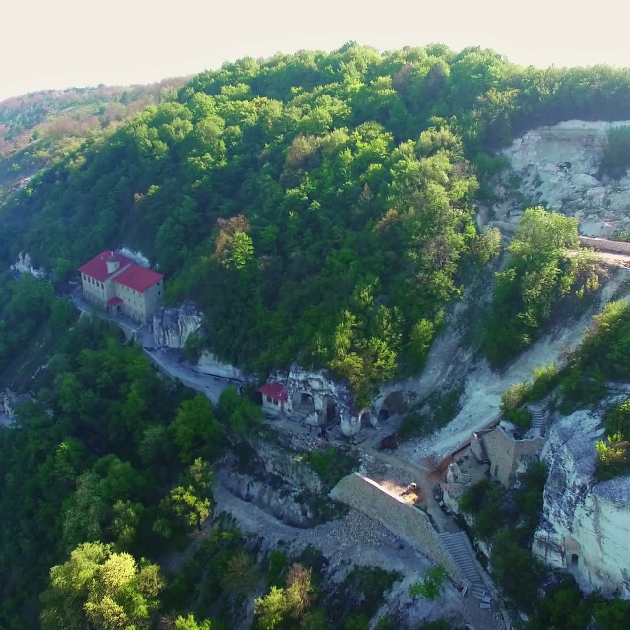 Religious buildings in the mountains. Old monastery and tower of Liadova monastery, Vinnytsia region, Ukraine. Top view