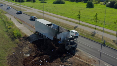 steady parallax shoot of badly burned car left on road side