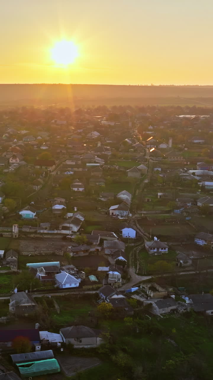 Aerial drone view of Orhei, Moldova and the Raut river at sunset. Vertical
