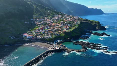 flyover of the beautiful town of seixal pools on a clear sunny day