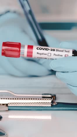 healthcare professional conducts covid20 blood test in clinical environment