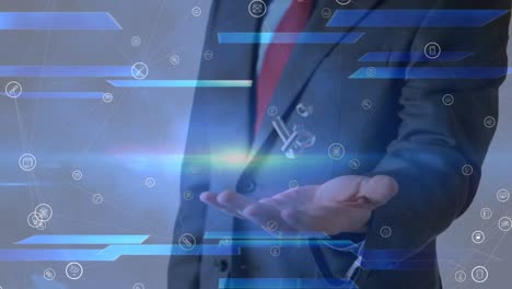 animation of network of media icons over businessman throwing and catching nuts and bolts
