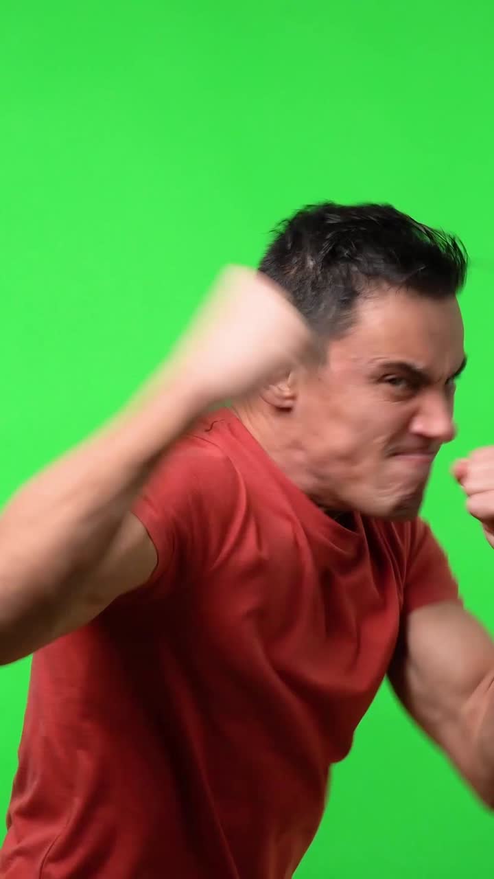 Man in red shirt acting on green screen