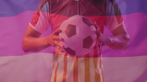 animation of flag of germany over african american male football player with ball