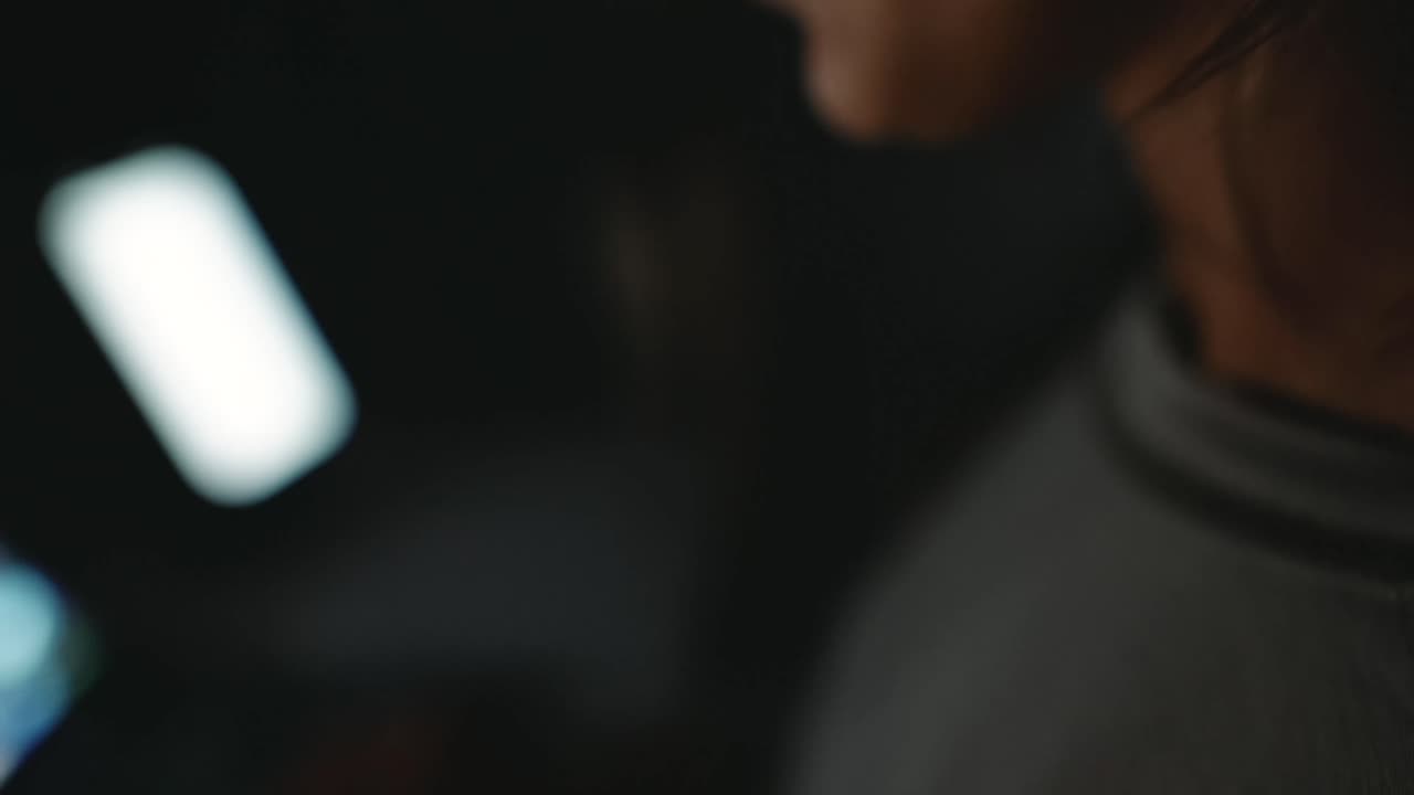 Person using phone in the dark