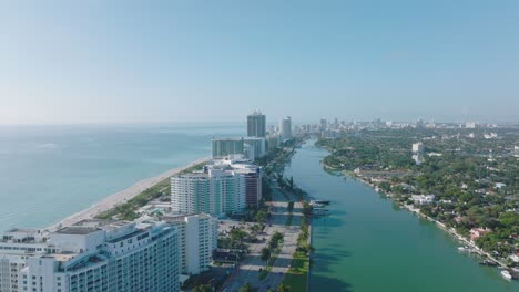 aerial footage of row of modern multistorey buildings on sea coast. luxury apartment houses or hotels. miami, usa