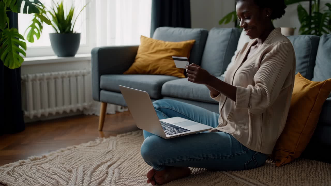 Woman working and making online purchases with laptop in living room
