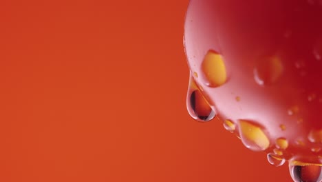 water droplets on a red tomato