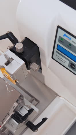 laboratory with sample from patient. nurse feeds data of test tubes for analysis