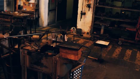 glassblower shaping a molten glass