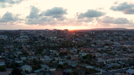 aerial descending into the north park neighborhood of san diego with hillcrest, mission hills, and mission bay in the distance. lower of 2
