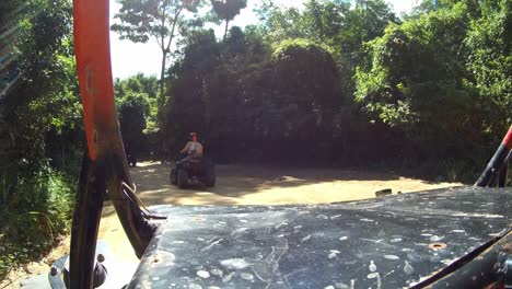 driving a buggy atv in view in thailand jungle