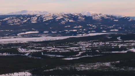 witness the frozen landscapes of fish lake surrounding downtown whitehorse in yukon. a stunning combination of urban and natural wilderness in canada’s north.