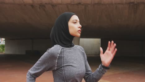 Side-view-of-woman-wearing-hijab-running-