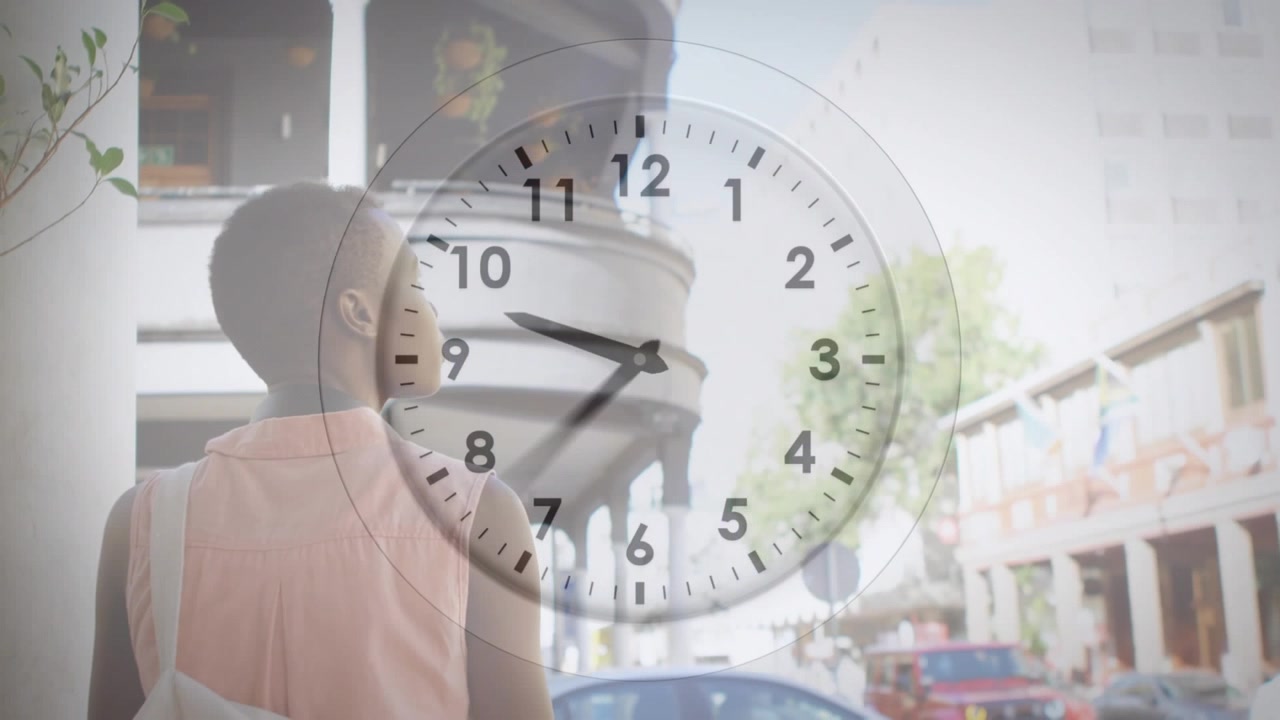 Animation of clock over african american woman walking