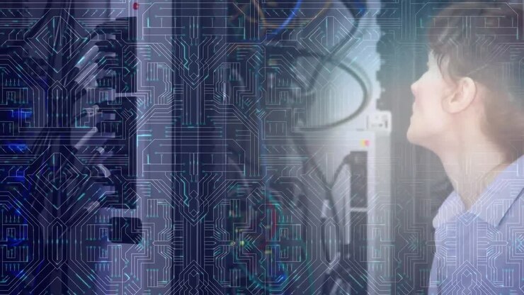Woman working on computer server while glowing motherboard moves in foreground