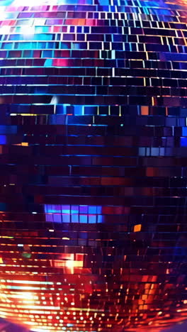 a disco ball with a red and blue color scheme. the ball is surrounded by a blurry background with a purple hue