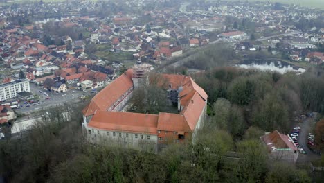 drone aerial view of the traditional german village herzberg am harz in the famous national park in central germany on a cloudy day in winter.