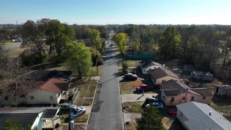 rising aerial of small single story homes in rural deep south