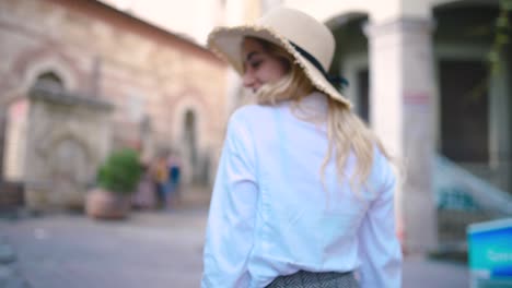 Slow-Motion:Attractive-young-beautiful-girl-with-hat-walks-and-discovers-places-in-narrow-street