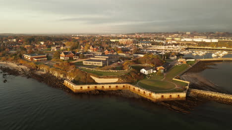 gorgeous sunset drone shot of the southern maine community college near fort preble