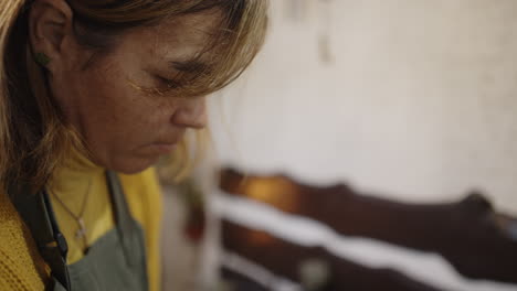 woman craftsperson focused on work