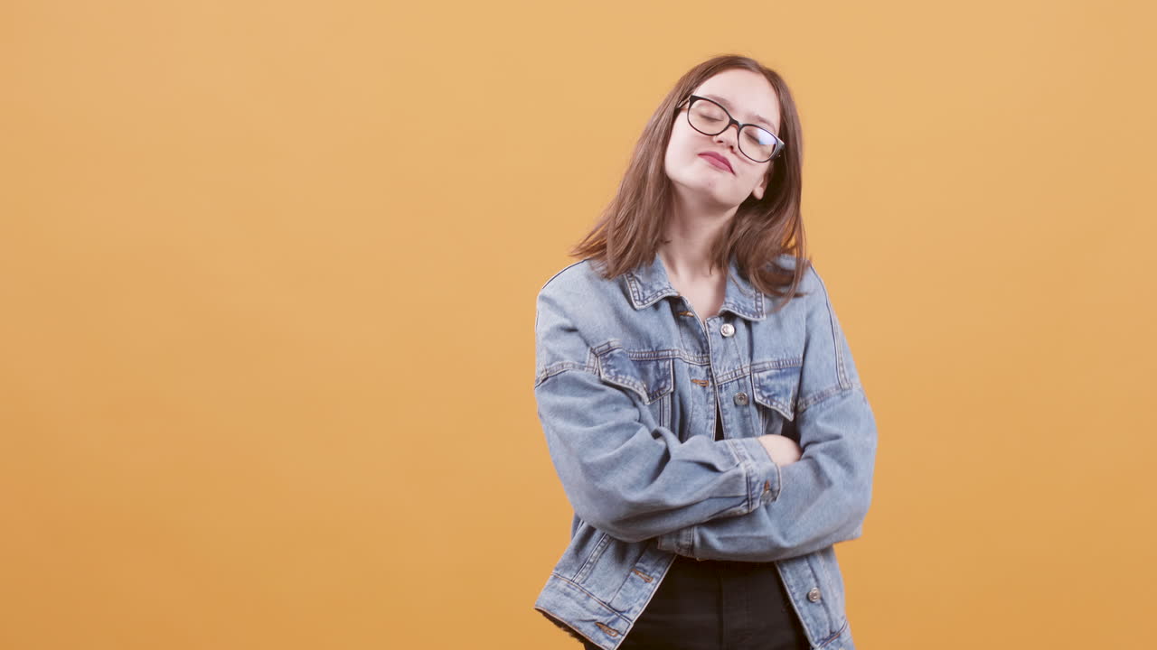 Young woman in denim jacket posing