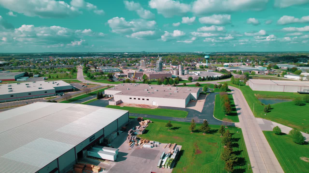 Warehouses, loading docks, and green landscapes at an industrial logistics hub in De Pere, Wisconsin.