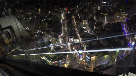 shibuya scramble sky escalator with shibuya scramble and tokyo skyline