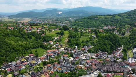 aerial drone footage of travnik, bosnia and herzegovina, capturing the historic old town, stari grad fortress, and the surrounding mountain landscape