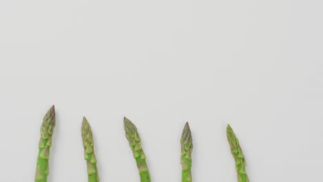 Video-of-fresh-asparagus-with-copy-space-over-white-background