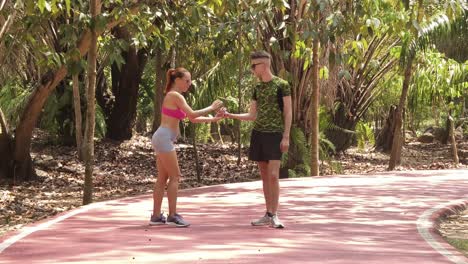 couple stretching outdoors in park