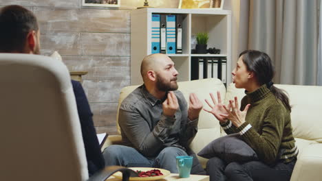 zoom in shot of young couple fighting at relationship counseling