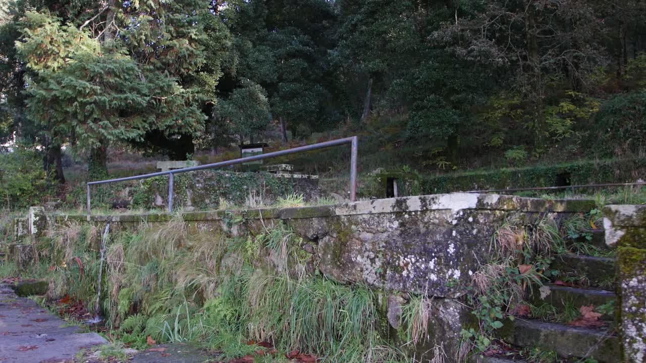 Old Small public tank with water.