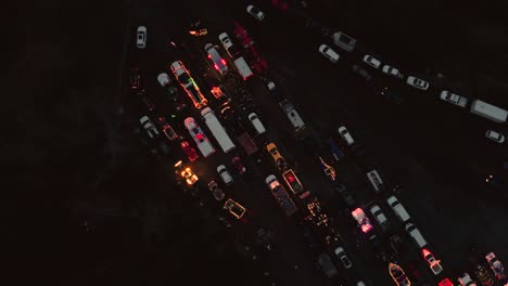 drone 4k footage christmas parade police sirene beacons traffic flying forward at night revealing the city in the distance