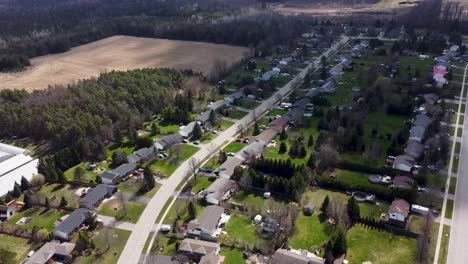 Drone-flying-over-sunny-summer-Toronto-neighborhood-near-green-space